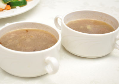 Clear vegetable and sorghum soup