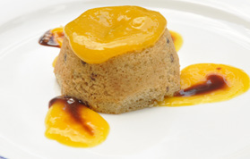 Sweet sorghum muffin served with mango and chocolate sauce