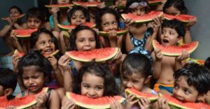 School children participate in a watermelon-eating competition in Patna, Bihar. (Photo: K M Sharma/ BCCL, Patna)