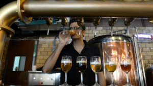 The Biere Club's head brewer Rohit Parwani tastes craft beer at the microbrewery in Bangalore. (AFP/Jiji)