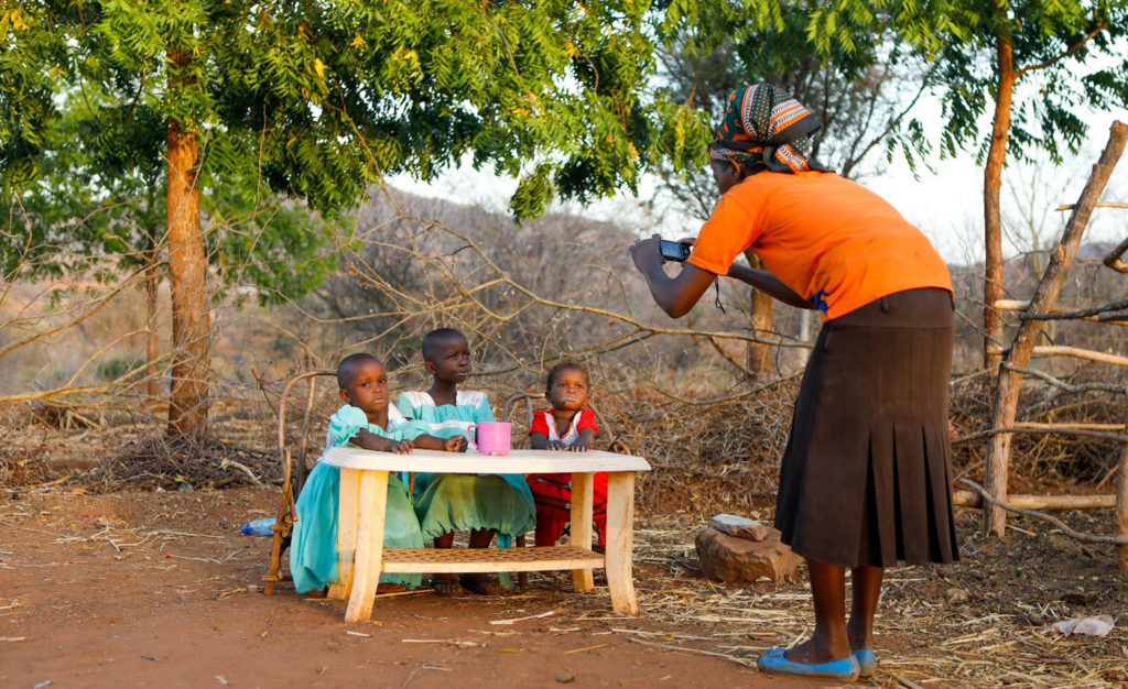 USING PHOTOVOICE TO ASSESS IMPACTS OF BEHAVIOR CHANGE NUTRITION ACTIVITIES IN KENYA